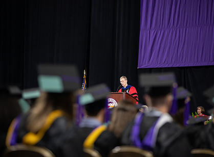 Rev. Philip L. Boroughs, S.J., president of the College, addresses students during the commencement ceremony.
