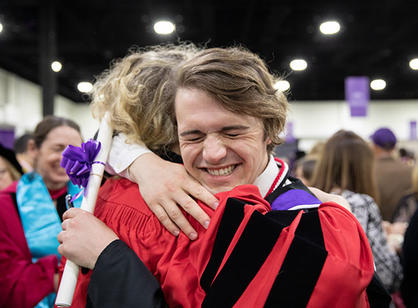 Students celebrate with their friends and family at the reception following the ceremony.
