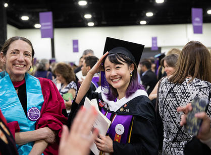 Students celebrate at the reception following the ceremony.