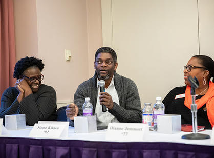 Students bang on a drum while acting out sets of data during an exercise.