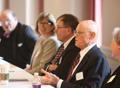 Ned Weyman addresses the room full of students, faculty and staff.