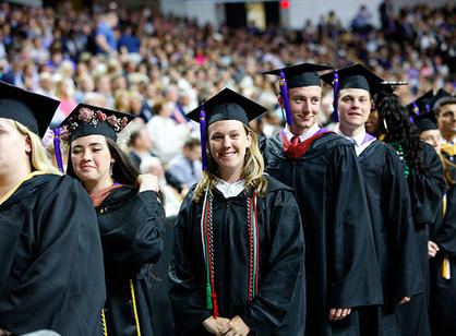 Students process into the DCU Center.