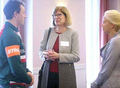 Mary Beth Sheridan speaks with students following the panel discussion.