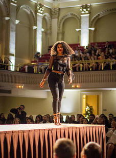 A student walks down the catwalk during the BSU 20th Annual Fashion Show.