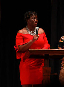 Fashion Show Founder Cheryl Yiadom '02 speaks to the audience during the BSU 20th Annual Fashion Show.