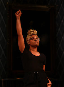 A student models during the black scene at the BSU 20th Annual Fashion Show.