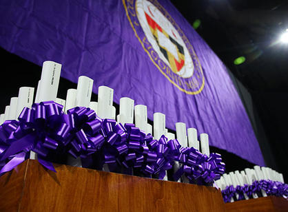 Diplomas sit waiting to be handed out to graduates.