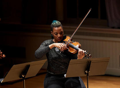 A woman plays the violin