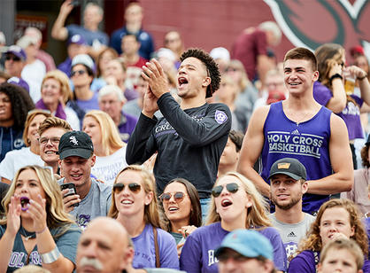 crowds cheer for Holy Cross football