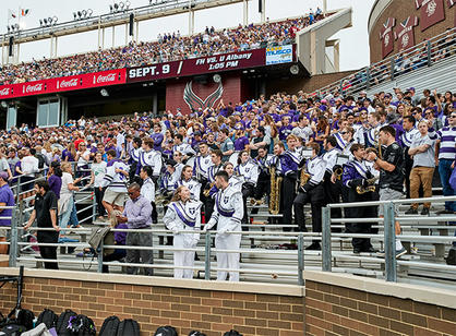 crowds cheer for Holy Cross football