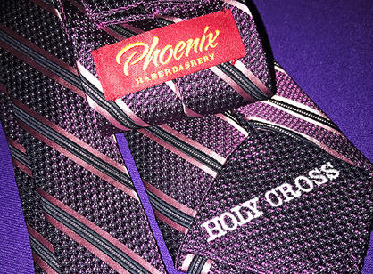 A deluxe reversible tie cut, sewn, folded and packaged here in Worcester.