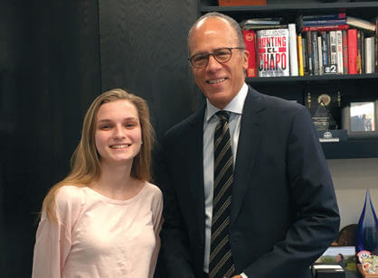 English major Audrey Holmes '19, a digital intern for NBC Nightly News, poses with anchor Lester Holt.