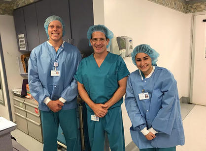 Lucas Hildreth '19 (left), a biology major, interns at NYU Winthrop Hospital in Mineola, New York.