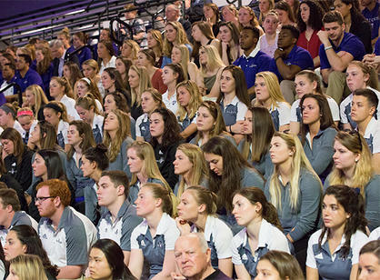 Student-athletes fill the bleachers during the dedication ceremonies for athletic complex.