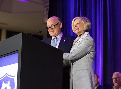 John Luth ’74 and Joanne Chouinard-Luth speak during the dedication ceremonies.