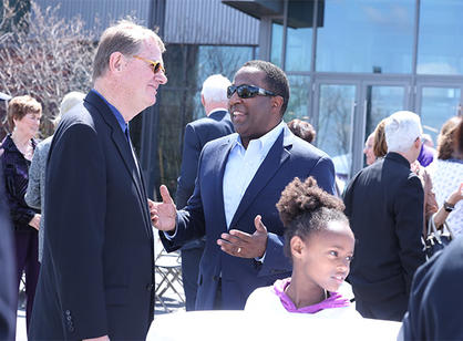 The Holy Cross community gathers to celebrate the dedication of the new athletic complex.