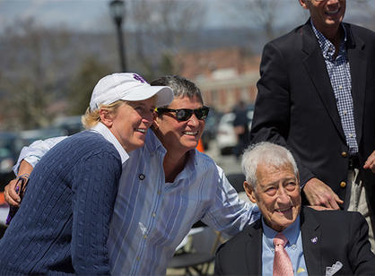 Holy Cross basketball legend Togo Palazzi '54, poses with other Crusaders celebrating the dedication of the athletic complex.