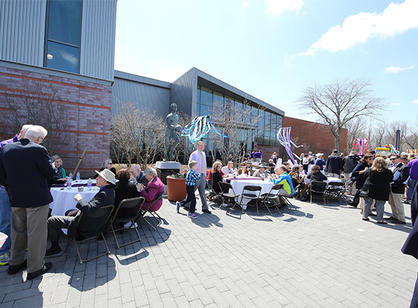 The Holy Cross community gathers to celebrate the dedication of the new athletic complex.