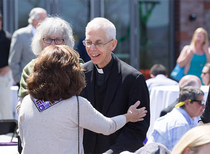 Rev. Michael C. McFarland, S.J., former president of Holy Cross, attends the dedication of the new athletic complex.