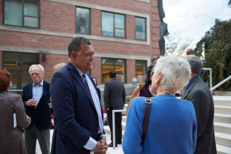 President Rougeau is interacting with faculty symposium guests in Science Plaza. Photo by Michael Quiet