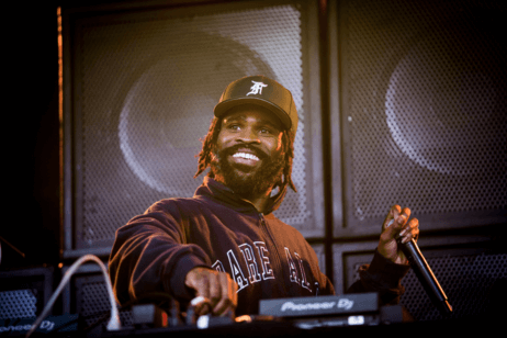 A DJ performs at a campus concert.