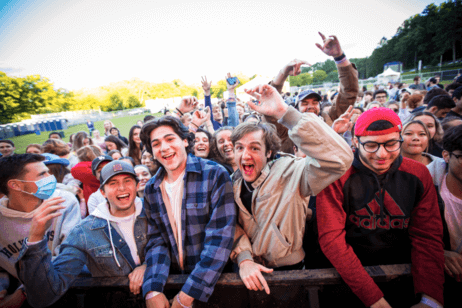 Students pose together for a photo at a campus concert.
