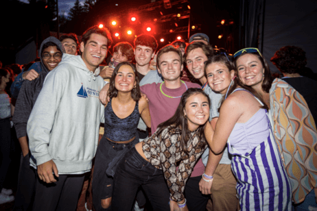 Students pose together for a photo at a campus concert.
