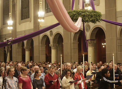 Study, faculty, staff and community members sing along during the Advent Festival of Lessons &amp; Carols.