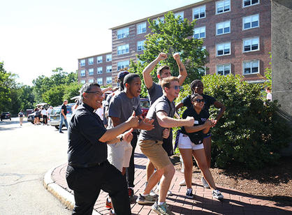 students and faculty cheer for incoming students