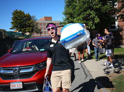 a student moves a comforter