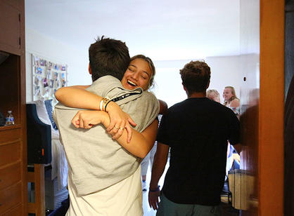 two students hug
