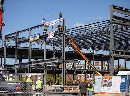 The beam sits on top of the building