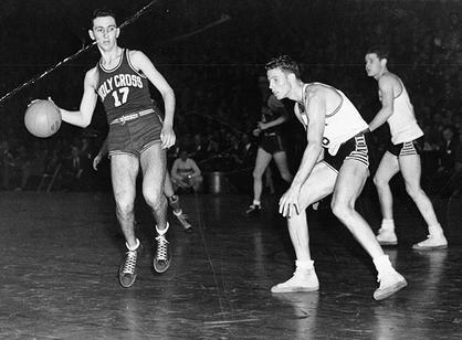 Bob Cousy dribbles a basketball