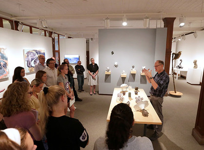 A group gathered in the Iris and B. Gerald Cantor Art Gallery