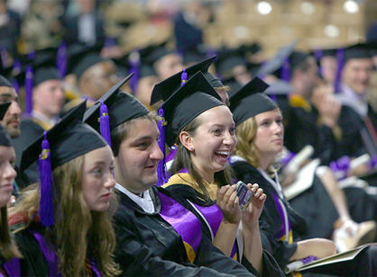 A student celebrates receiving their diploma.