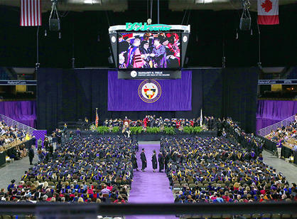 Students make their way to the stage.