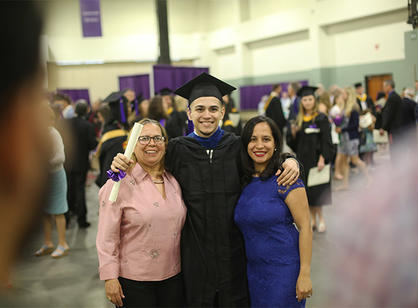 Students celebrate with their friends and family at the reception following commencement.