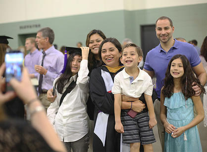 Students celebrate with their friends and family at the reception following commencement.