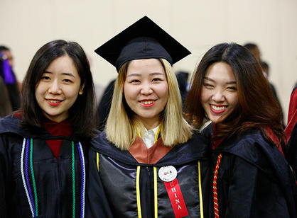 Students celebrate at the reception following commencement.