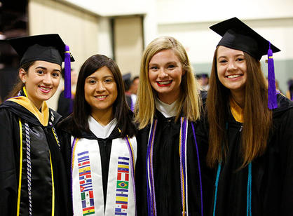 Students celebrate at the reception following commencement.
