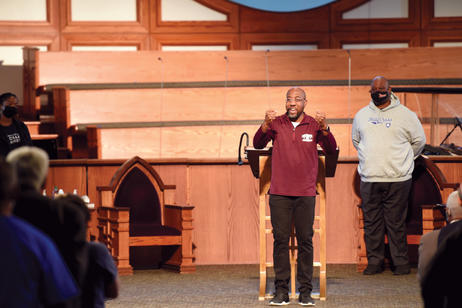 Revs. Warnock and Vaughn display their school pride at the church’s College Sunday service.