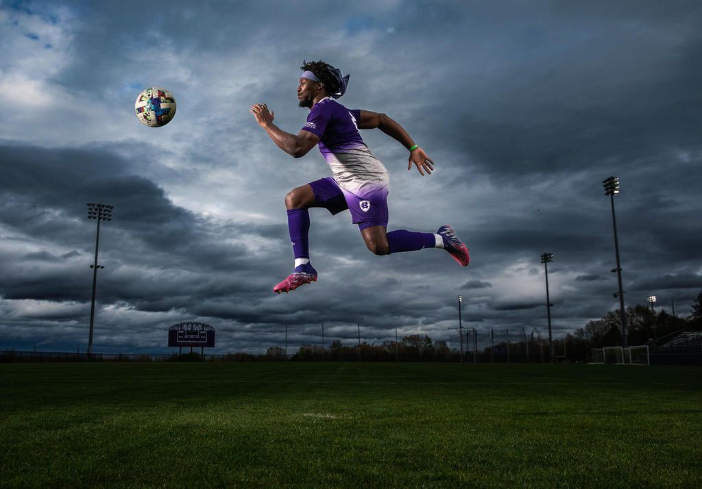A soccer player jumping in the air 