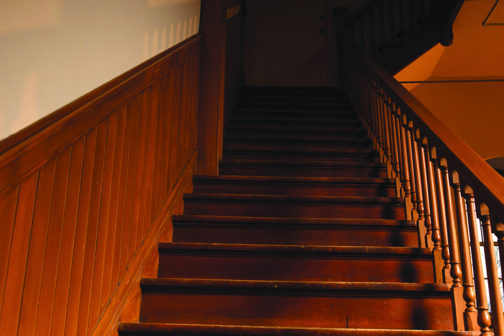A staircase leads into darkness