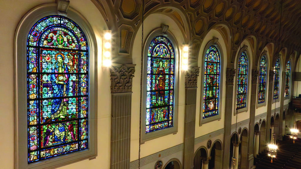 A row of nine, tall stained glass windows