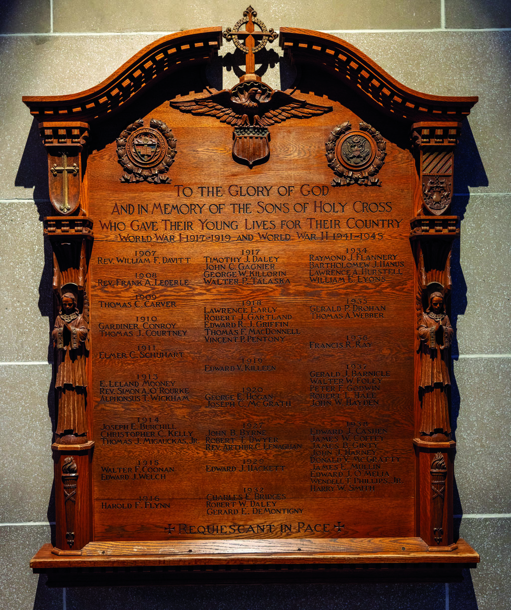 Wood plaque engraved with names.
