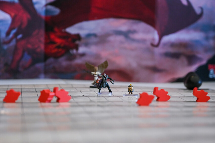 Tiny figures stand on a map