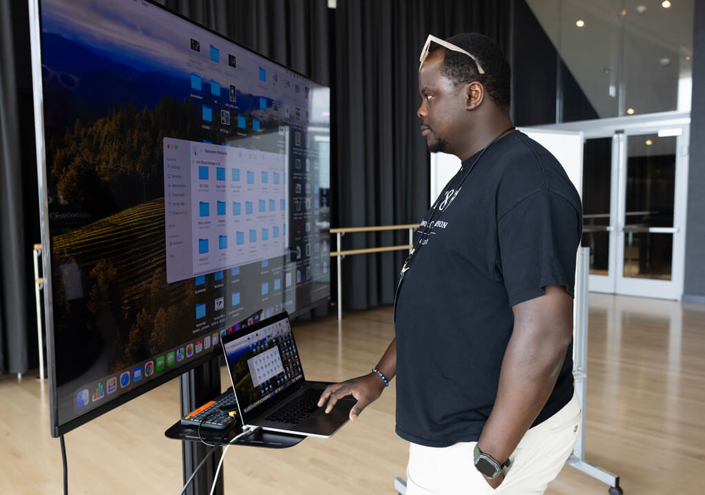 Man at keyboard looking at monitor