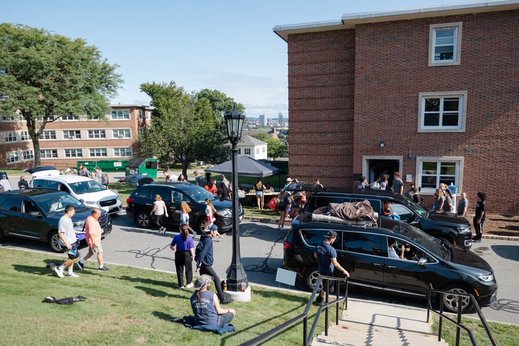 Cars line up outside buildings