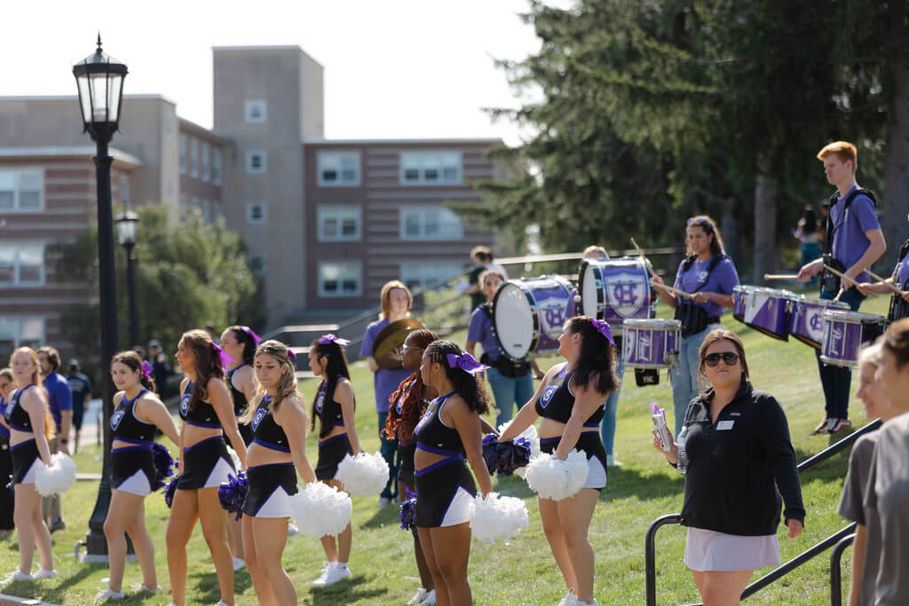 Cheerleaders and band perform