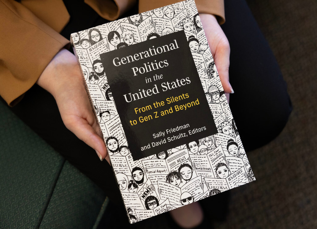 A closeup on two hands holding a book